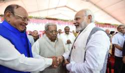 Vaghela was greeted by PM Modi at Rupani's swearing--in ceremony