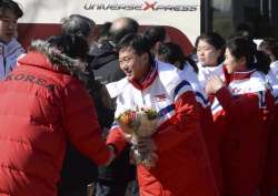 North Korean women’s ice hockey players are greeted as they arrive at the South Korea’s national training center on Thursday