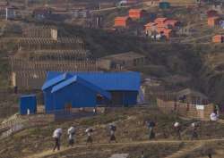 Rohingya refugee Muslims who were staying in no-man’s land at Bandarban between Myanmar and Bangladesh border carry their belongings to new locations after arriving at Balukhali refugee camp