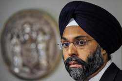 FILE- In this Dec. 12, 2017, file photo, Bergen County Prosecutor Gurbir Grewal looks on as Governor-elect Phil Murphy nominates him for attorney general in Trenton, New Jersey.