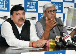 AAP Rajya Sabha MP Sanjay Singh with party's spokesperson Ashutosh addresses a press conference over the detainment of two AAP MLAs, in New Delhi on Thursday.