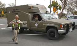 A sheriff's hostage negotiation team passes a California highway patrol checkpoint at the Veterans Home of California in Yountville, California on Friday, March 9, 2018.