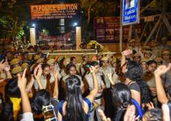 Students of JNU protest against JNU professor who is accused of sexually harsassing female students, at Vasant Kunj Police Station in New Delhi on Monday. 