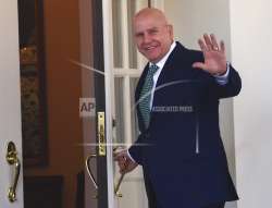 National security adviser HR McMaster waves as he walks into the West Wing of the White House in Washington. 