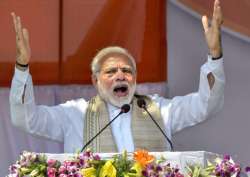 PM Narendra Modi speaks during the swearing-in ceremony of the newly elected Tripura Chief Minister Biplab Kumar Deb and others, in Agartala on Friday.