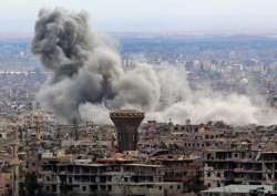 Smoke rises from the besieged rebel-held Eastern Ghouta, Syria