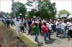 Congress workers protest outside party's office in Mangaluru over distribution of tickets.