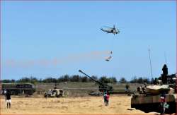 Armed Force personnel stage a live demo in presence of Defence Minister Nirmala Sitharaman (unseen)? in Chennai on Sunday.