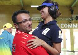 Heena Sidhu celebrates with her husband and coach Ronak Pandit after winning the gold medal during the women's 25m Pistol final at Commonwealth Games