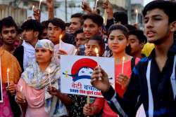 Students take part in a candlelight march to protest against Kathua rape case, in Jabalpur on Thursday. The case has triggered protests across the nation.