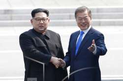 North Korean leader Kim Jong Un, left, shakes hands with South Korean President Moon Jae-in at the border village of Panmunjom in the Demilitarized Zone on Friday, April 27, 2018.