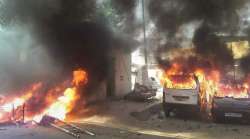 Meerut: Vehicles set on fire by a group of protesters during 'Bharat Bandh' call given by Dalit organisations against the 'alleged' dilution of Scheduled Castes / Scheduled Tribes Act, in Meerut on Monday. 