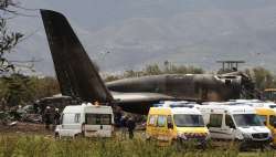 Firefighters and civil security officers work at the scene of a fatal military plane crash in Boufarik, near the Algerian capital, Algiers, Wednesday, April 11, 2018.