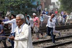 Protesters throw stones during 'Bharat Bandh' call given by Dalit organisations against the alleged dilution of Scheduled Castes / Scheduled Tribes Act, in Ghaziabad on Monday.