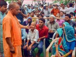 Uttar Pradesh Chief Minister Yogi Adityanath meets the victims of Wednesday's storm, in Agra on Saturday