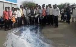 Farmers spill milk on the road during their 10-day protest