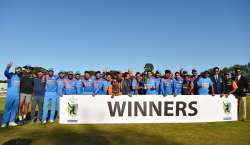 Indian cricket team poses with the trophy