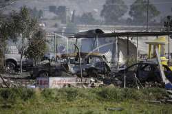 Wrecked buildings and scorched ground covered a rural patch of modest homes and small farm plots in Tutlepec. (AP Photo)