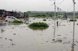 Vehicles stuck in the flood waters of Yamuna River at Usmanpur in east Delhi on Tuesday, July 31, 2018. The river is flowing above the danger mark flooding the areas along its banks.?