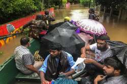 India Army personnel rescue flood affected people in Ernakulam district of Kerala on Tuesday.
?