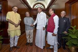 Newly-elected Deputy Chairman of the Rajya Sabha Harivansh Narayan Singh (2nd L) being greeted by Vice President M Venkaiah Naidu as Parliamentary Affairs Minister Ananth Kumar (L), MoS for Parliamenatary Affairs Vijay Goel (2nd R) and Rajya Sabha Secretay General Desh Deepak Verma look on, outside his office at Parliament, in New Delhi on Thursday, Aug 9, 2018