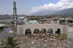 A mosque heavily damaged by the quake was half submerged and a shopping mall was reduced to a crumpled hulk.