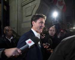 Prime Minister Justin Trudeau leaves the Office of the Prime Minister and Privy Council after an agreement was reached in the NAFTA negotiations in Ottawa, Ontario, Sunday, September 30, 2018. 