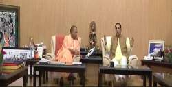 Gujarat Chief Minister Vijay Rupani with UP CM Yogi Adityanath.