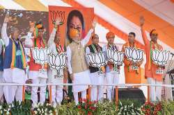 Prime Minister Narendra Modi waves at the crowd during an election rally in support of the BJP candidates in Bhilwara on Monday.