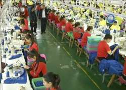 Trainees working at the garment factory