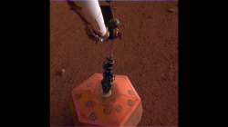 NASA's InSight lander places first instrument on Mars