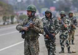 Security personnel keep strict vigil on Jammu-Srinagar Highway on the eve of Republic Day in Jammu