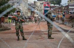 Army personnel stand guard at Gujjar Nagar area during a curfew, imposed on the third day after the clash between two communities over the protest against the Pulwama terror attack, in Jammu