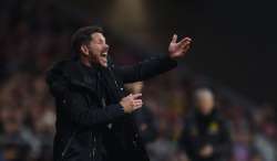 UEFA charges Atletico coach Simeone for obscene gesture