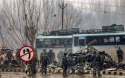 Security personnel carry out rescue and relief works at the site of suicide bomb attack at Lathepora Awantipora in Pulwama district of south Kashmir. 