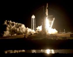 Crew capsule rockets toward space station with test dummy