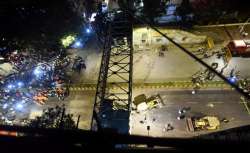 Mumbai: A general view shows a part of the partially collapsed foot overbridge near a train station in south Mumbai