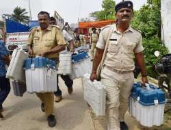 Bhagalpur: Security officials collect Electronic Voting Machines (EVM) and other election material f