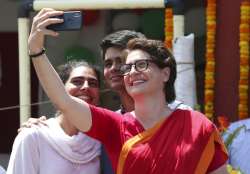 Congress party General secretary Priyanka Vadra takes selfie with her children after her brother Congress president Rahul Gandhi filed his nomination papers for the upcoming general elections in Amethi, Uttar Pradesh state, India, Wednesday, April 10, 2019