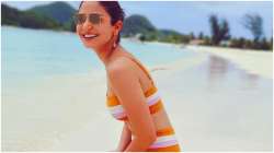 Anushka Sharma Latest news, Posing in a fun bright coloured swimwear, Anushka Sharma painted a happ