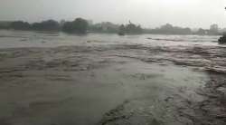 The pyres facing the river were turned into islands as Yamuna waters entered the ghat on Monday evening, even as a few people went on with the last rituals of their family members.