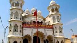 People offer prayers near Ravidas temple site