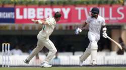 South Africa's Anrich Nortje, left, celebrates the dismissal of India's captain Virat Kohli, right, during the third and last cricket test match between India and South Africa in Ranchi, India, Saturday