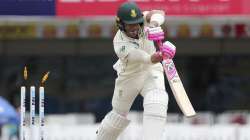 South Africa's captain Faf du Plessis is bowled out by India's Umesh Yadav during the third day of third and last cricket test match between India and South Africa in Ranchi, India, Monday