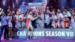 Players and officials of Bengal Warriors celebrate with the trophy after defeating Delhi Dabbang KC during the finals of the seventh edition of Pro-Kabaddi league, in Ahmedabad, Saturday