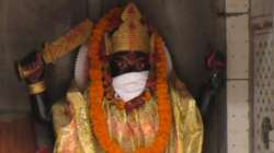 Anti-pollution masks save Gods from bad air at Varanasi temple.