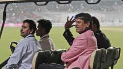 Former Indian cricketer Kapil Dev acknowledges the crowd during a grand parade of India's former cricket captains during the first day of the second test match between India and Bangladesh, in Kolkata