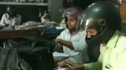 Employees wear helmets to work at government office in UP 