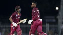 West Indies' and Shimron Hetmyer, right, and Shai Hope run between the wickets to score during the first one day international cricket match between India and West Indies in Chennai