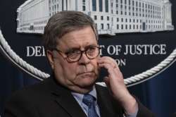 Attorney General William Barr speaks to reporters at the Justice Department in Washington, Monday, J